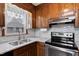 Featuring a stainless steel oven, the kitchen has ample counter space and natural light at 651 Sagamore Dr, Louisburg, NC 27549