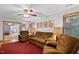 Spacious living room with hardwood floors, ceiling fan, and cozy seating, great for relaxing and entertaining at 651 Sagamore Dr, Louisburg, NC 27549