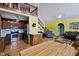 Open-concept living space with kitchen, stairs to a loft, and comfortable furnishings at 651 Sagamore Dr, Louisburg, NC 27549