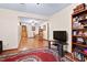 Spacious living room with hardwood floors, rug, and staircase leading to the second floor at 651 Sagamore Dr, Louisburg, NC 27549