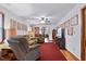 Spacious living room with hardwood floors, a ceiling fan, and an abundance of natural light at 651 Sagamore Dr, Louisburg, NC 27549