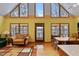 Bright living room with vaulted ceiling, ample windows, and lake views at 651 Sagamore Dr, Louisburg, NC 27549