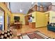 Open concept living area with natural light and exposed beams, with wood floors and a comfortable aesthetic at 651 Sagamore Dr, Louisburg, NC 27549
