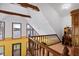 Upstairs loft space with lake views, natural light, and a workstation at 651 Sagamore Dr, Louisburg, NC 27549