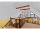 Spacious loft area featuring exposed ceiling beams and large windows with lake views at 651 Sagamore Dr, Louisburg, NC 27549