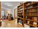 Cozy office space with built-in bookshelves, a computer desk, and hardwood floors at 651 Sagamore Dr, Louisburg, NC 27549