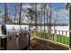 Outdoor stainless grill on wooden deck with lovely lake views at 651 Sagamore Dr, Louisburg, NC 27549