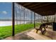 Covered patio with comfortable seating and lake views at 651 Sagamore Dr, Louisburg, NC 27549