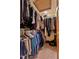 Spacious walk-in closet with ample hanging space for clothes and plenty of room for shoes at 651 Sagamore Dr, Louisburg, NC 27549