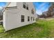 Exterior of the home featuring white siding, well-maintained yard, and a fenced-in area at 6923 Fox Haven Pl, Raleigh, NC 27616