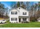 Charming two-story home with white siding, black shutters, and a well-maintained front lawn at 6923 Fox Haven Pl, Raleigh, NC 27616