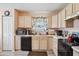 Well-lit kitchen with ample counter space, a double sink, and matching appliances at 6923 Fox Haven Pl, Raleigh, NC 27616