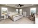 Serene main bedroom with plush carpeting, natural light, and neutral decor at 709 Teal Lake Dr, Holly Springs, NC 27540