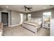 Serene main bedroom with plush carpeting, natural light, and neutral decor at 709 Teal Lake Dr, Holly Springs, NC 27540