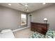 Bedroom featuring a ceiling fan, neutral paint, and lots of natural light at 709 Teal Lake Dr, Holly Springs, NC 27540