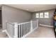 Open loft area with plush carpeting, natural light, and versatile space at 709 Teal Lake Dr, Holly Springs, NC 27540