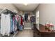 Spacious walk-in closet with custom shelving, natural light, and plenty of storage space at 709 Teal Lake Dr, Holly Springs, NC 27540