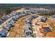 A winding street flows through a development of new homes with some in construction and solar panels at 74 Silver Moon Ln, Clayton, NC 27527