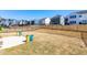 Spacious backyard with a black fence, landscaping, and views of surrounding houses at 74 Silver Moon Ln, Clayton, NC 27527