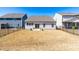 Fenced backyard with black fencing and a view of the rear of the house and surrounding neighborhood at 74 Silver Moon Ln, Clayton, NC 27527