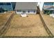 Aerial view of the fenced backyard with patio, perfect for outdoor entertaining and relaxation at 74 Silver Moon Ln, Clayton, NC 27527