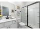Modern bathroom features a sleek vanity, a shower with black trim, and contemporary fixtures at 74 Silver Moon Ln, Clayton, NC 27527