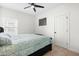 Cozy bedroom featuring a ceiling fan, plush carpet, and a comfortable bed with stylish bedding at 74 Silver Moon Ln, Clayton, NC 27527