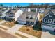 Charming home featuring a two-car garage, well-manicured lawn, and inviting front porch at 74 Silver Moon Ln, Clayton, NC 27527