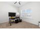 Functional home office with a desk setup, carpeted floors, a ceiling fan, and natural light from the window at 74 Silver Moon Ln, Clayton, NC 27527