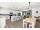 Bright kitchen with an island flows to dining area with seating, perfect for entertaining and Gathering meals at 74 Silver Moon Ln, Clayton, NC 27527