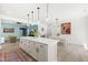 A spacious kitchen with a large island, white countertops, and modern pendant lighting at 74 Silver Moon Ln, Clayton, NC 27527