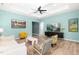 Spacious living room with modern decor, wood floors, tray ceiling, and an open layout at 74 Silver Moon Ln, Clayton, NC 27527