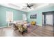 Elegant living room with ample natural light, tray ceiling, wood floors, and open concept design at 74 Silver Moon Ln, Clayton, NC 27527