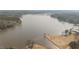 Expansive aerial view of a tranquil lake surrounded by lush greenery at 75 Traceway N, Sanford, NC 27332