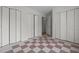 Bedroom with a pink and white checkered pattern floor and multiple closets at 75 Traceway N, Sanford, NC 27332
