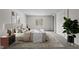 Bedroom featuring a window view, a cozy bed, and a stylish brown area rug at 75 Traceway N, Sanford, NC 27332