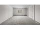 Spacious bedroom with a window and a large grey carpet at 75 Traceway N, Sanford, NC 27332