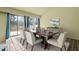 Dining room with large windows and sliding glass doors offering a view of the deck at 75 Traceway N, Sanford, NC 27332