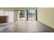 Bright living room with tile floors and access to the outdoor deck at 75 Traceway N, Sanford, NC 27332