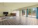 Bright living room with tile floors and access to the outdoor deck at 75 Traceway N, Sanford, NC 27332