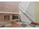 Living room with brick fireplace and a staircase leading to the second floor at 75 Traceway N, Sanford, NC 27332