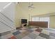 Bright living room with brick accent wall, high ceilings, and a staircase at 75 Traceway N, Sanford, NC 27332