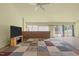 Bright living room with brick half-wall and access to the outdoor deck at 75 Traceway N, Sanford, NC 27332