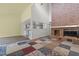 Living room with brick fireplace and an open layout connecting to the kitchen at 75 Traceway N, Sanford, NC 27332