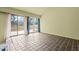Sunroom with large windows and sliding glass doors offering a view of the deck and backyard at 75 Traceway N, Sanford, NC 27332