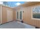 Backyard patio with a door and window provides an outdoor retreat at 7914 Yester Ct, Raleigh, NC 27615