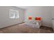 Cozy bedroom features a bright window, carpeted floors, and comfortable daybed at 7914 Yester Ct, Raleigh, NC 27615