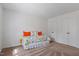 Cozy bedroom features a bright window, carpeted floors, and comfortable daybed at 7914 Yester Ct, Raleigh, NC 27615