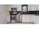 Well-equipped kitchen featuring stainless steel appliances, granite countertops, and ample cabinet space for a modern touch at 7914 Yester Ct, Raleigh, NC 27615