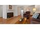 Comfortable seating area with a fireplace, hardwood floors, and stylish decor at 7914 Yester Ct, Raleigh, NC 27615
